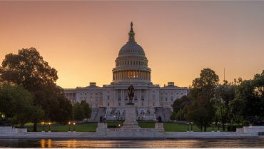 An image of the capital building at dusk.